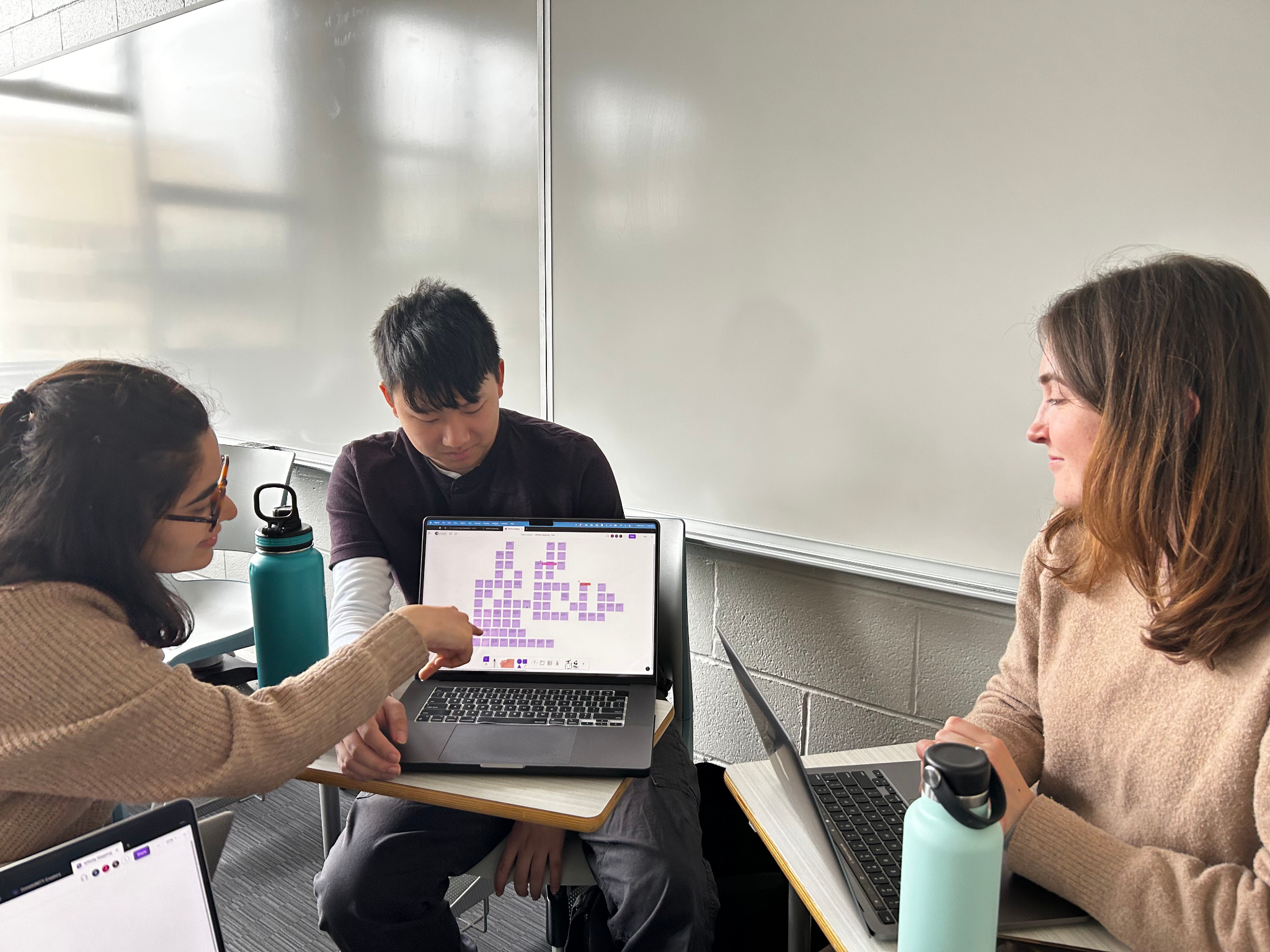 Hero image of Jadon, evaluating insights with teammates